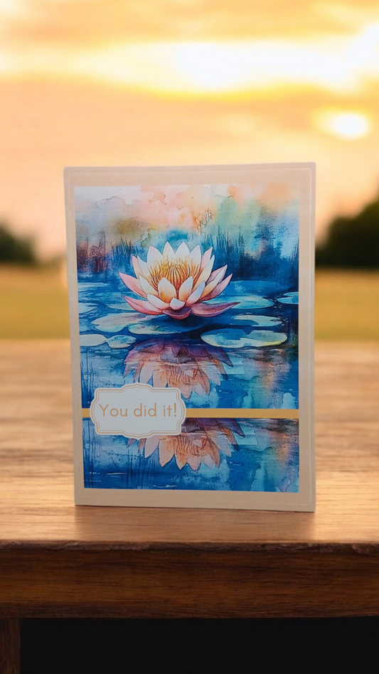 Greeting card featuring a blooming lotus on water with the message “You did it!”
Image Description: A greeting card with a bright lotus floating on water, cover text reads “You did it!” Inside message reads “From challenge to courage, you bloom. Congratulations on your recovery!”