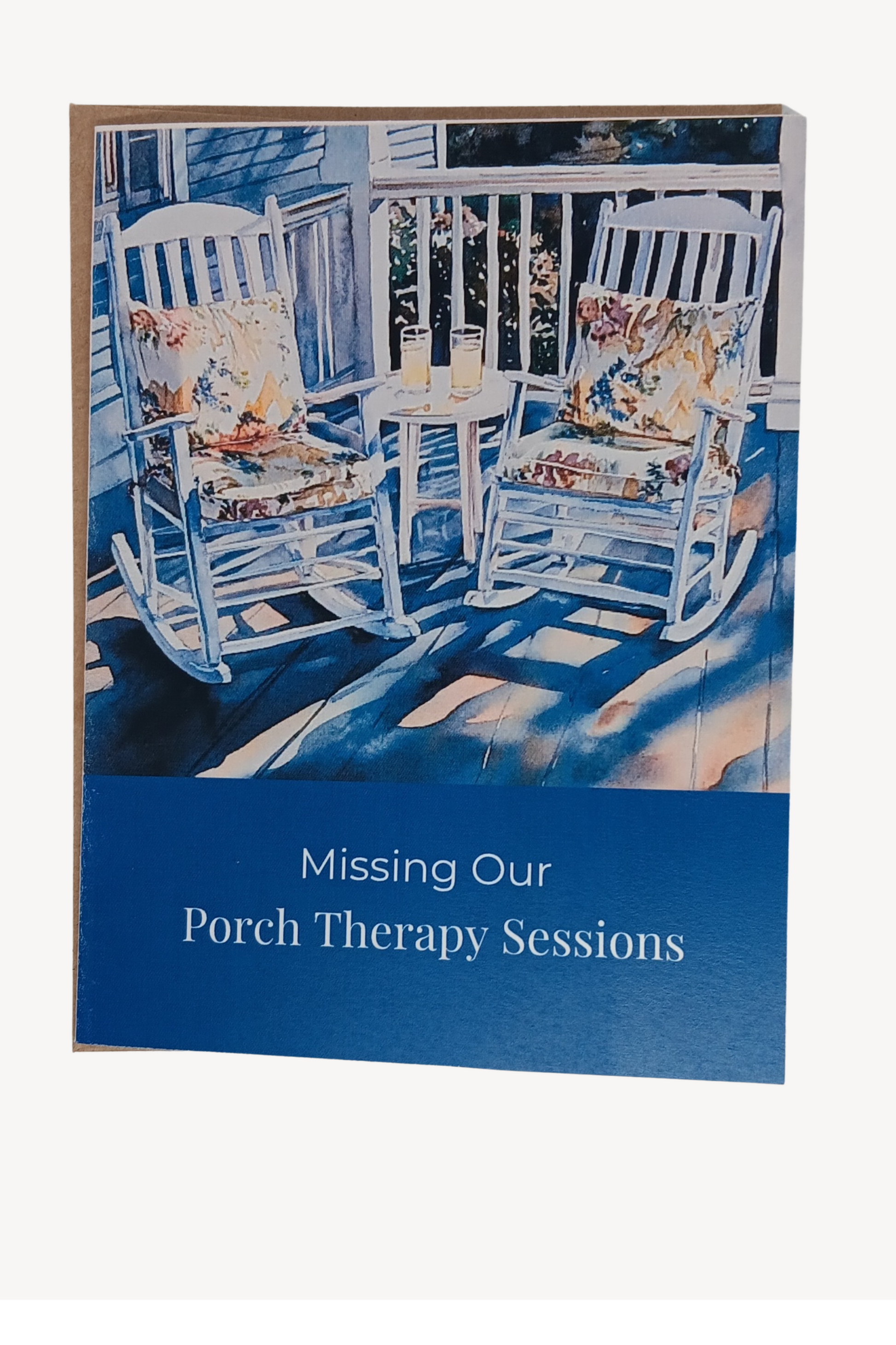 Sophisticated A2 note card featuring watercolor illustration of sun-drenched wooden rocking chairs with vibrant cushions. Cover reads 'Missing Our Porch Therapy Sessions', with message about wisdom and heart-to-heart connections inside. Deep Sapphire. Includes choice of brown kraft or white linen envelope.