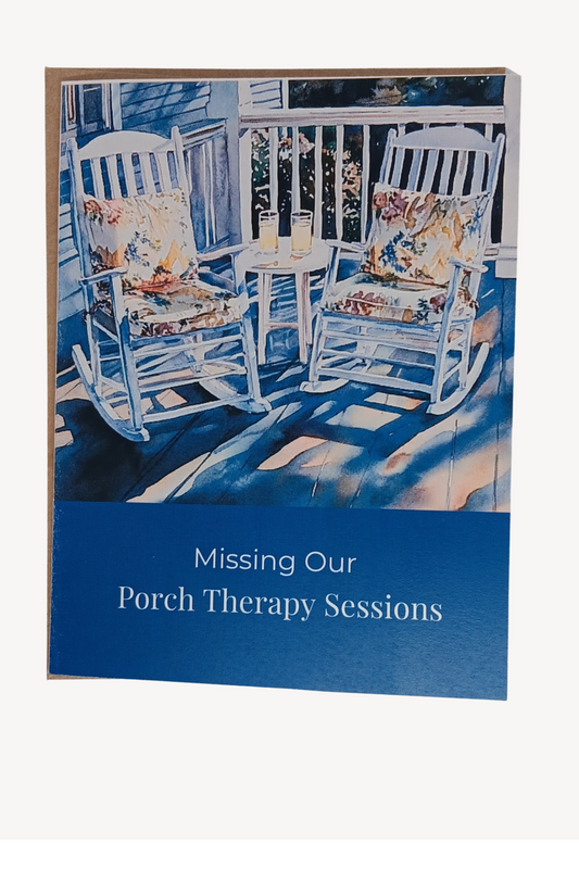 Sophisticated A2 note card featuring watercolor illustration of sun-drenched wooden rocking chairs with vibrant cushions. Cover reads 'Missing Our Porch Therapy Sessions', with message about wisdom and heart-to-heart connections inside. Deep Sapphire. Includes choice of brown kraft or white linen envelope.